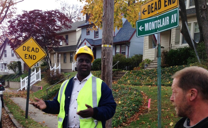 Scott Hallamin of PSE&G works with his crew to restore power on Montclair Avenue in Nutley, N.J.