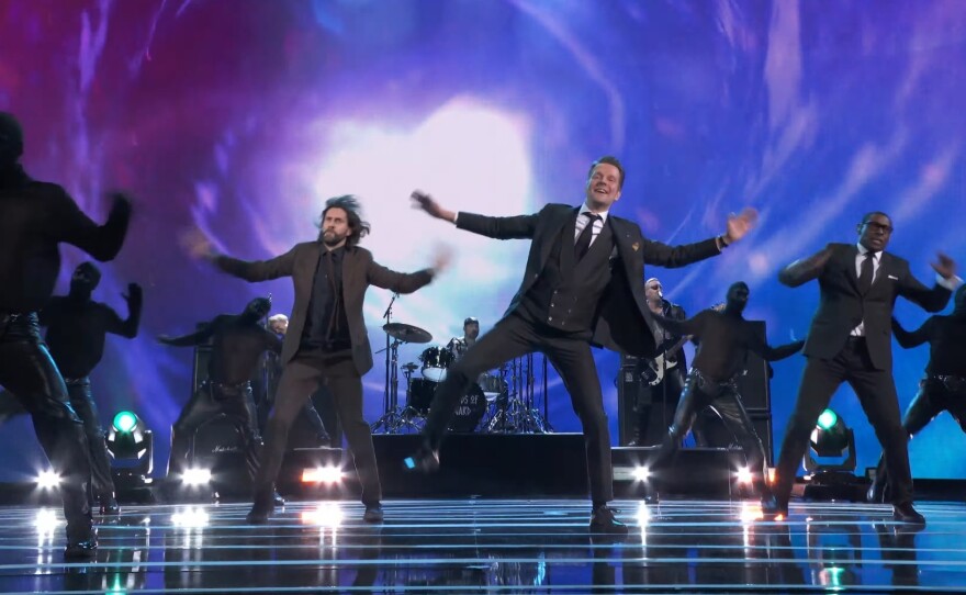 From left to right: Masked dancers, Alan Wake star Ilkka Villi, game creator Sam Lake, and "Mr. Door" actor David Harewood.