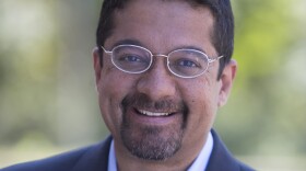 The image is an undated photograph of Shankar Vedantam, host of the "Hidden Brain" podcast.