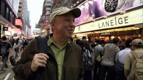 Adventure travel author Richard Bangs braves the nightly throngs of shoppers in the Mong Kok district of Kowloon. 