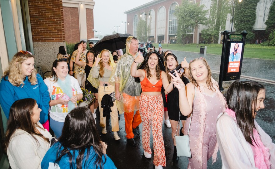 Despite the rain, fans remained in good spirits as they gathered from around the world to see Harry Styles.