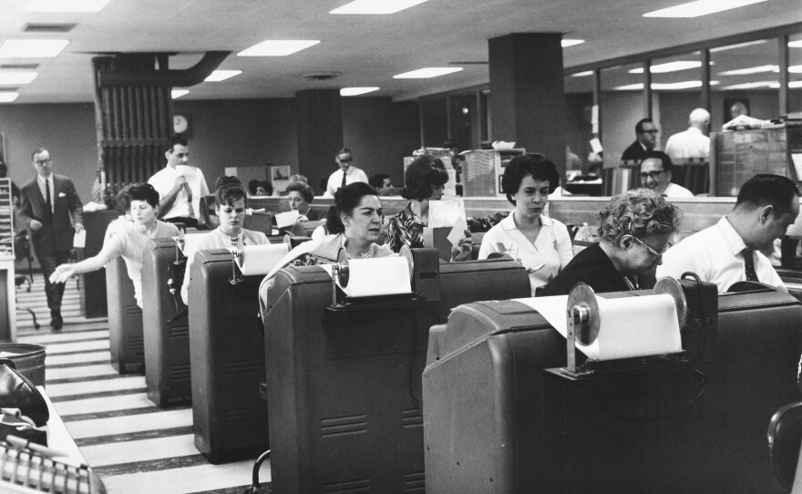 Employees of Goodbody & Co. work at the stock brokerage's headquarters in Manhattan, N.Y., circa 1965.