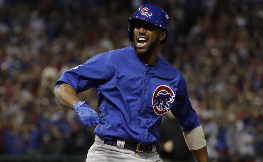 The Chicago Cubs' Dexter Fowler reacts after hitting a home run during the first inning of Game 7 of the World Series against the Cleveland Indians Wednesday in Cleveland.