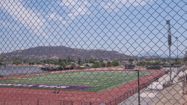 Santana High School's football field, on the east side of campus, is shown through a chain link fence on Aug. 12, 2026.