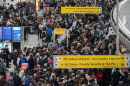 People wait in a TSA line at the John F. Kennedy International Airport, Sunday, March 22, 2026, in New York. (AP Photo/Yuki Iwamura)