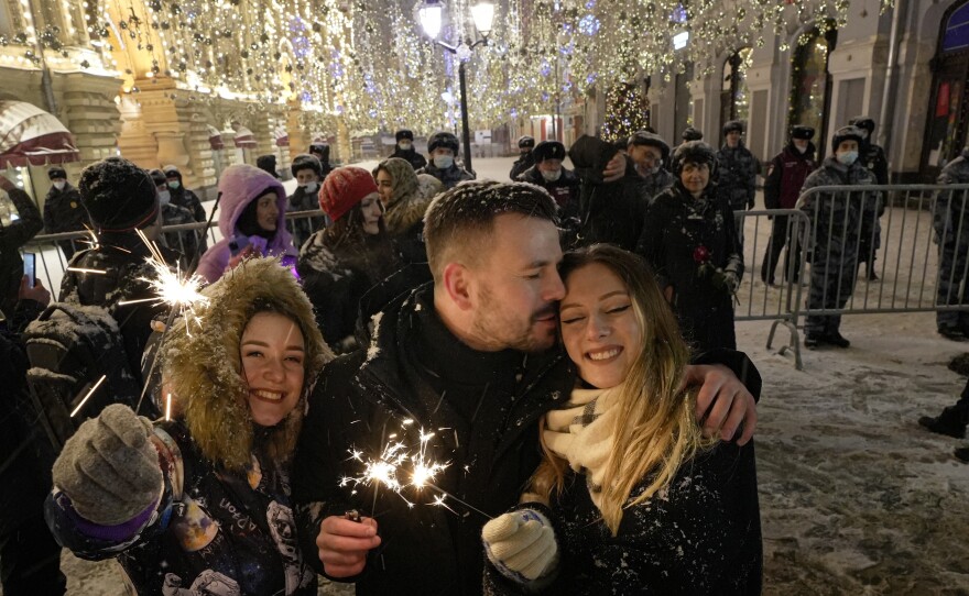 People celebrate the New Year in Nikolskaya street near an empty Red Square due to pandemic restrictions during New Year celebrations in Moscow, Russia, on Saturday.