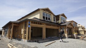 This May 4, 2018 file photo shows a house under construction in Roseville, Calif. California's unemployment rate edged up slightly in March even as the state continued adding jobs. The state Employment Development Department reported Friday, April 19, 2019 that the rate increased a tenth of a percentage point over February, to 4.3 percent.