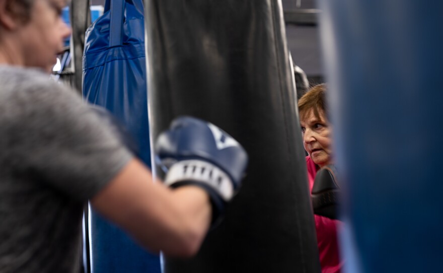 Linda Kozik (right) throws punches during a boxing class for people living with Parkinson's at the Fit 4 Boxing Club in Pittsburgh, Pa.