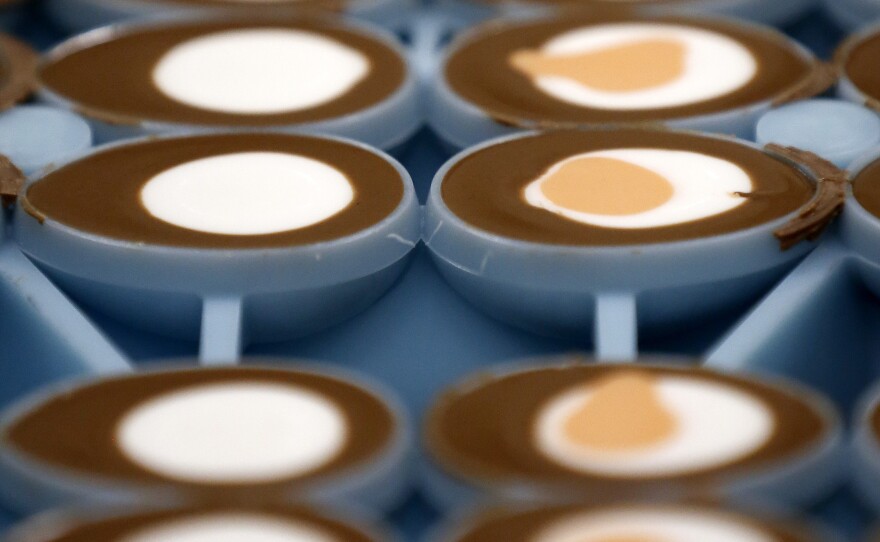 Cadbury Creme Eggs on the production line at a Cadbury factory in Birmingham, U.K. For many, the eggs are filled not just with gooey candy "whites" and "yolks" but with childhood memories.