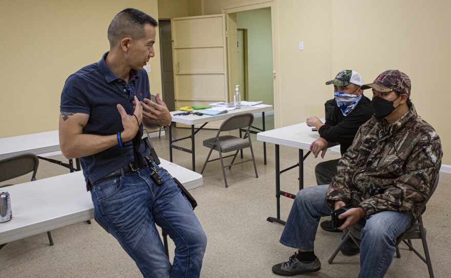 Left to right: Compton School Police Chief William Wu, 49, speaks with Anthony Refuerzo, 61, and Sunha Kim after the firearms training course.