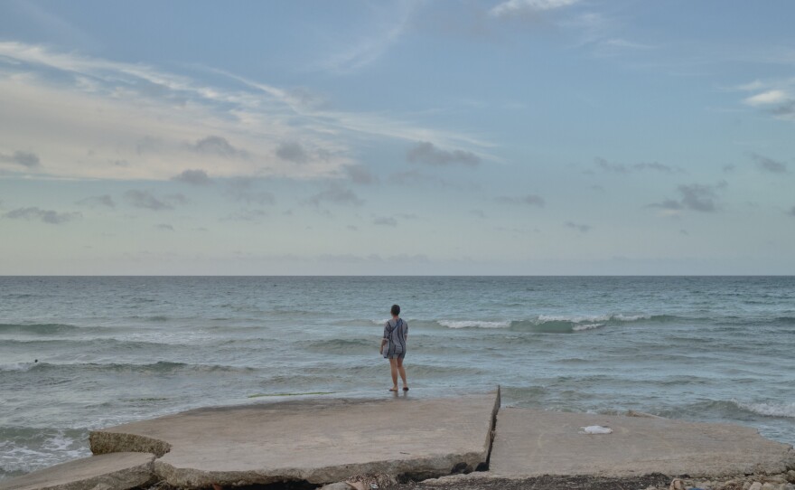 Lauren looks out at the sea in Havana.