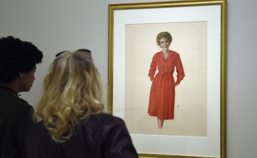 Two women look at a portrait of Nancy Reagan hanging in the National Portrait Gallery in Washington, D.C., on Monday.