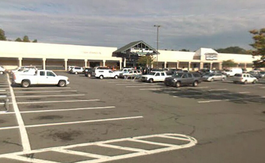 A college student spent the night in jail and was charged with felony counts after agents approached her car, suspecting she bought beer at this Harris Teeter grocery store in Charlottesville, Va.