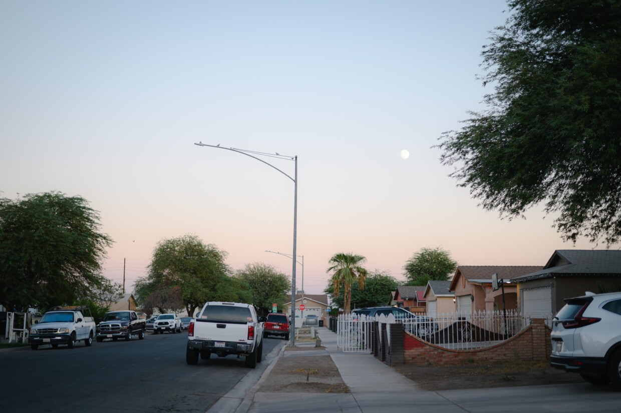 The moon rises above a neighborhood in El Centro, California in Imperial County on October 15, 2024.