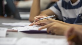 High school students complete a class assignment on August 14, 2019.