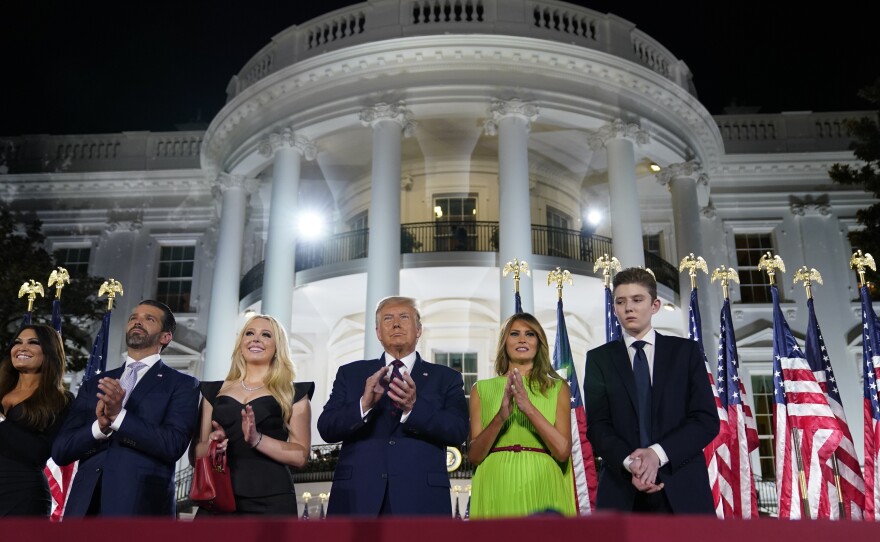 From left, Kimberly Guilfoyle, Donald Trump Jr., Tiffany Trump, President Trump, first lady Melania Trump and Barron Trump stand on the South Lawn of the White House on the last night of the Republican National Convention.