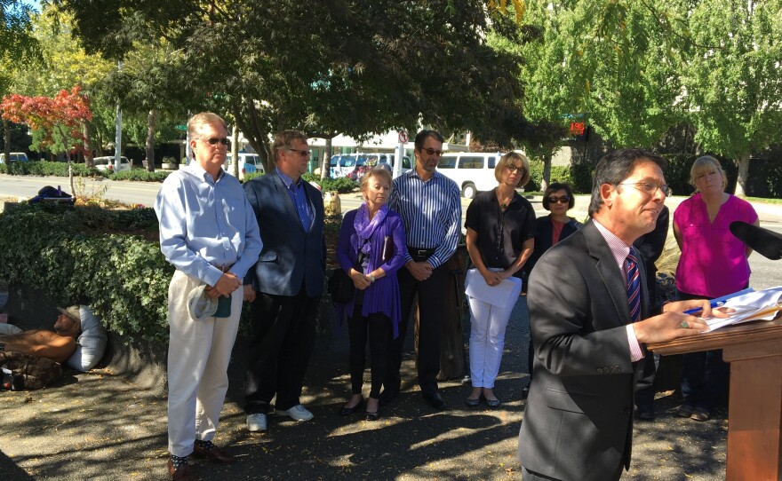 Republican state senator Mark Miloscia gives a press conference in front of a group small group of homeless people. Miloscia says the homeless need more supervision.