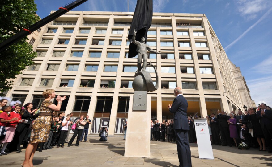 A statue of Russian cosmonaut Yuri Gagarin is unveiled in London on Thursday, as Gagarin's daughter, Elena (left) and Britain's Prince Michael of Kent look on. Gagarin became the first man in space April 12, 1961, as he orbited Earth.