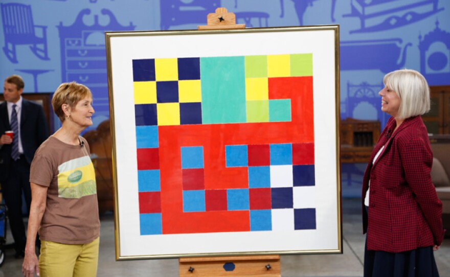 Colleene Fesko (right) appraises a Peter Halley gouache on paper for $10,000 to $15,000 in Baton Rouge, La.