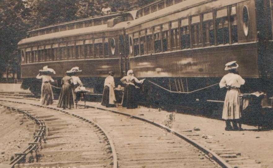 Waiter carriers sell their wares along the platform. According to Williams-Forson's book, Bella Winston's mother is one of the women pictured in this photo, which was taken circa 1900s.