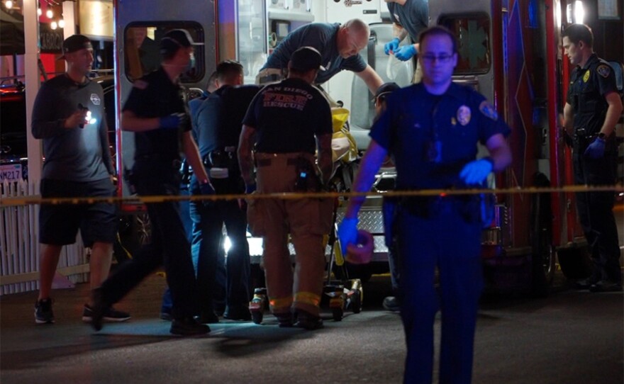 Paramedics taking care of a shooting victim in the Gaslamp Quarter, July 18, 2021.