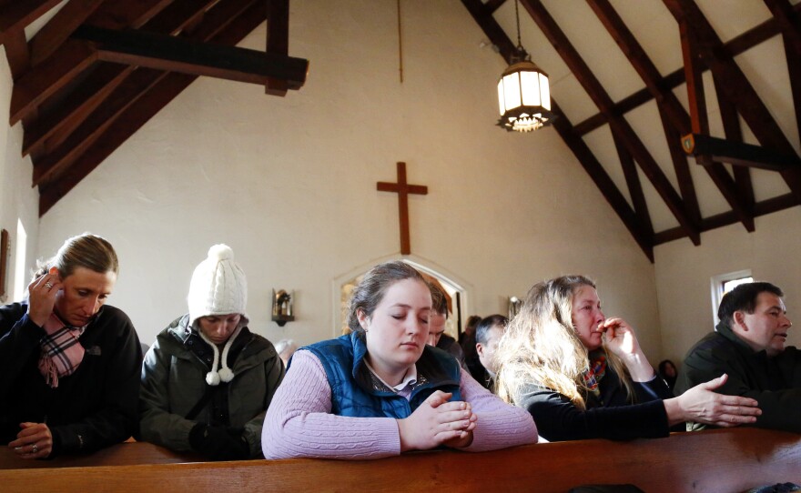 Parishioners attend a prayer service at Saint Johns Episcopal Church near Sandy Hook Elementary School in Newtown, Conn.