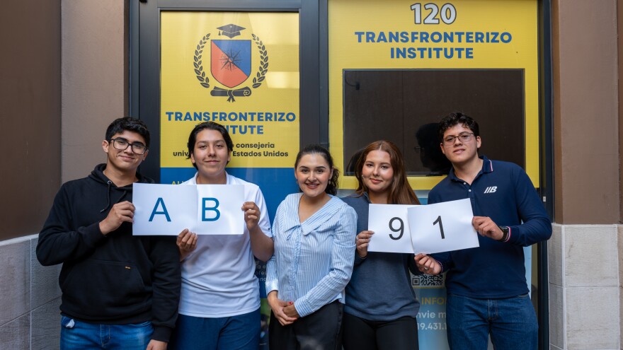 From left, students Angel Saldivar, Cesar de Leon, Miranda de Leon and Alexander Ortiz stand with Mitzi Salgado (center) outside the Transfronterizo Institute in San Ysidro on March 25, 2026.