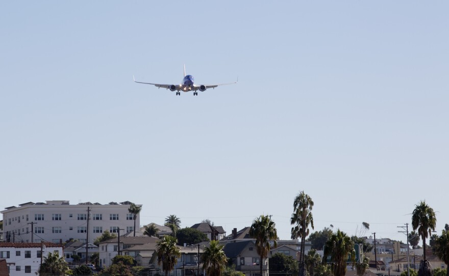 An airplane flying over Bankers Hill before landing at San Diego International Airport, Nov. 18, 2016.