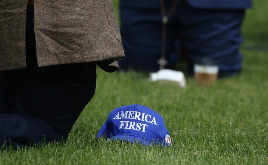 An anti-LGBTQ gathering held a rosary prayer near the "Pride in the Park" event, led by Christian nationalist Dave Reilly. Several participants had hats with the logo of the white nationalist "America First" group.