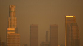 Smog shrouds the Los Angeles skyline. New ozone standards from the EPA aim to reduce smog, but may actually increase global warming.
