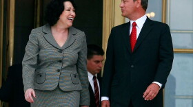 Chief Justice John Roberts (R) and Associate Justice Sonia Sotomayor walk out of the U.S. Supreme Court building after her investiture ceremony on September 8, 2009 in Washington, DC. 