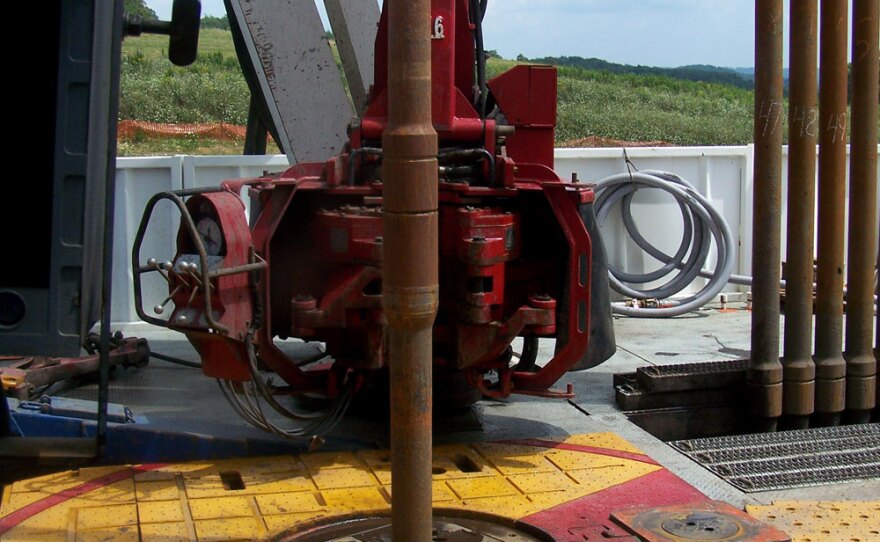 The drilling platform on a shale gas drilling rig. The shaft in the center is turning a drill bit deep underground. The drilling operation continues 24/7.