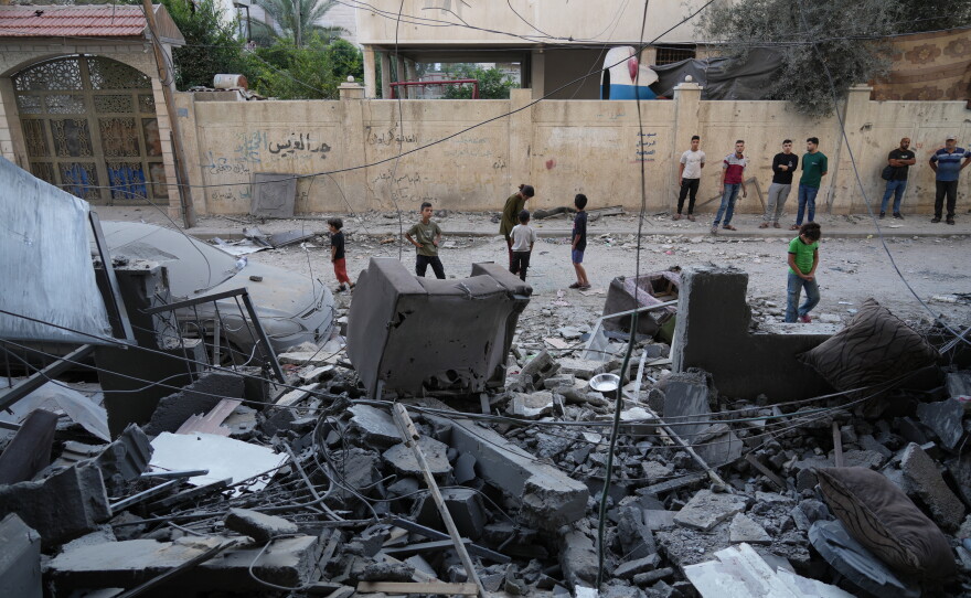 Palestinians inspect the site of an early morning Israeli airstrike in Gaza city, Saturday, Oct. 3, 2026.