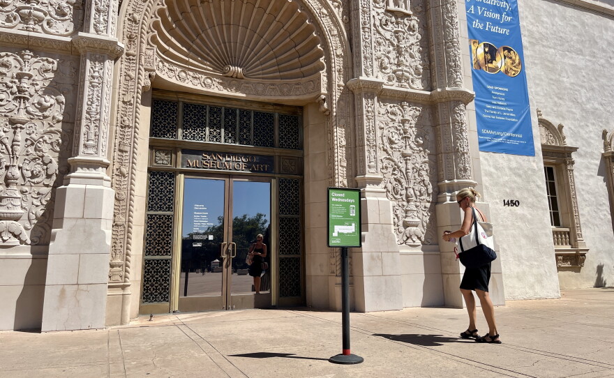 A woman walks towards the front exterior doors of San Diego Museum of Art, Sept. 2, 2026.