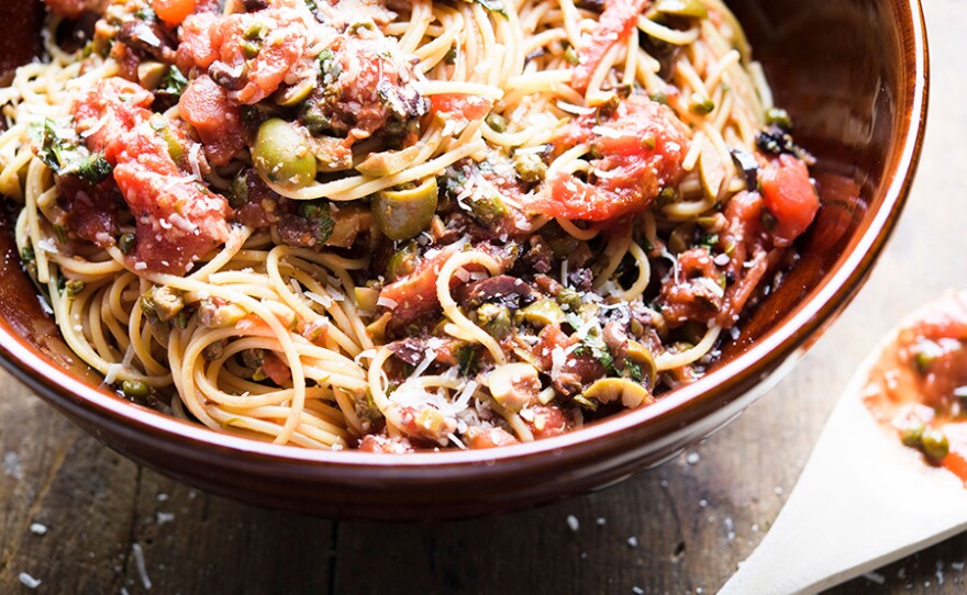 Spaghetti Puttanesca, packed with briny olives and capers.