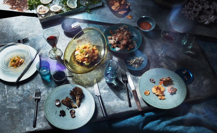 Allie Wist's "Flooded" dinner spread includes burdock and dandelion root hummus with sunchoke chips; jellyfish salad; roasted hen of the woods mushroom; fried potatoes with chipotle vegan mayo; salted anchovies; and oysters with slippers. Most of these are foods that might be more resilient to climate change and, therefore, what we could be eating in the future, Wist says.