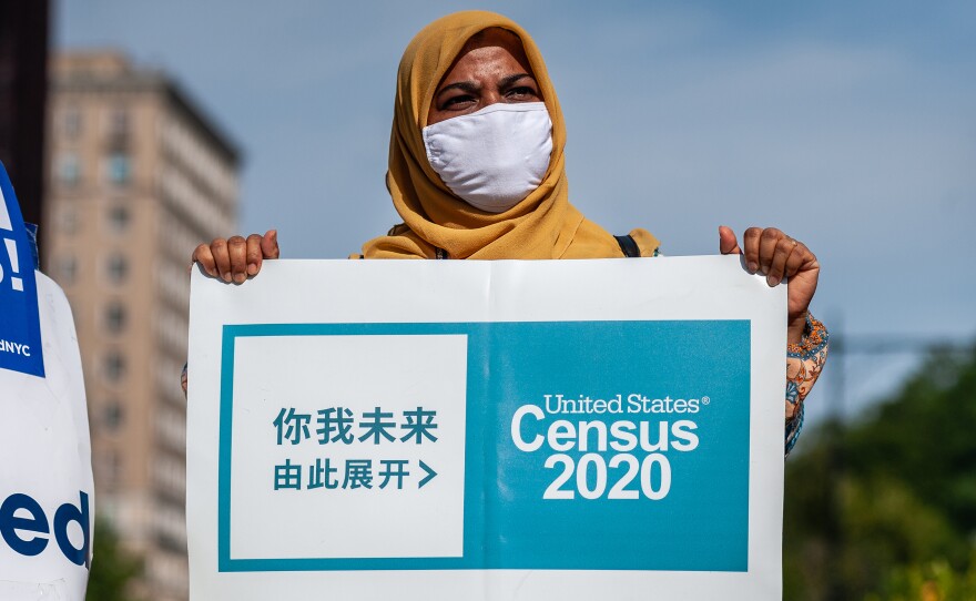 A census supporter holds up a sign during a 2020 rally in  New York City.