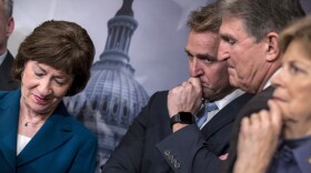 From left, Sen. Susan Collins, R-Maine, Sen. Jeff Flake, R-Ariz., Sen. Joe Manchin, D-W.Va., and Sen. Jeanne Shaheen, D-N.H., finish a news conference on the bipartisan immigration deal they reached during a news conference at the Capitol in Washington, Thursday, Feb. 15, 2018.