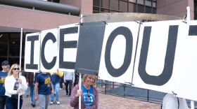Protestors gather outside the federal building calling federal immigration agents to stop overstepping their authority on November 20, 2025.