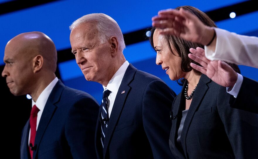 Democratic presidential hopefuls (from left): Sen. Cory Booker, D-N.J., former Vice President Joe Biden, and Sen. Kamala Harris, D-Calif., onstage before the July debate.
