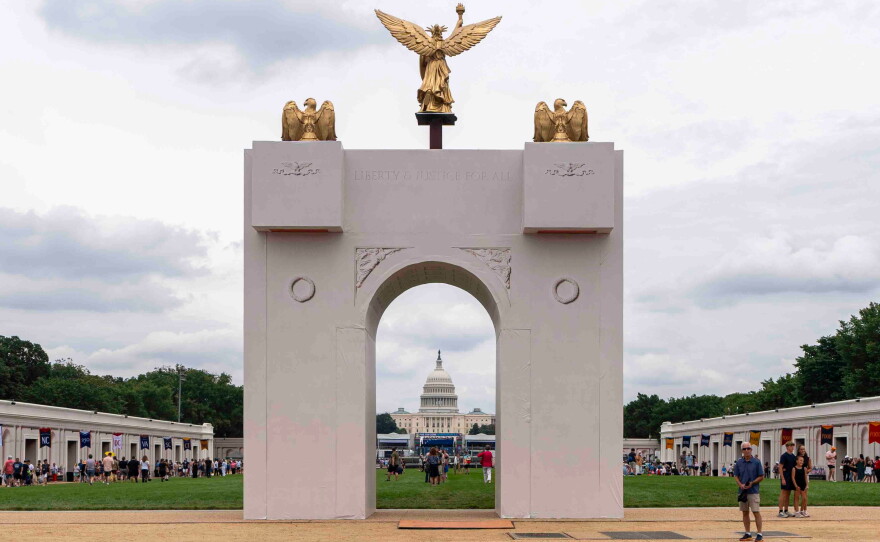 A mockup of President Donald Trump's proposed triumphal arch stands at the Great American State Fair on the National Mall, June 27, 2026, in Washington.