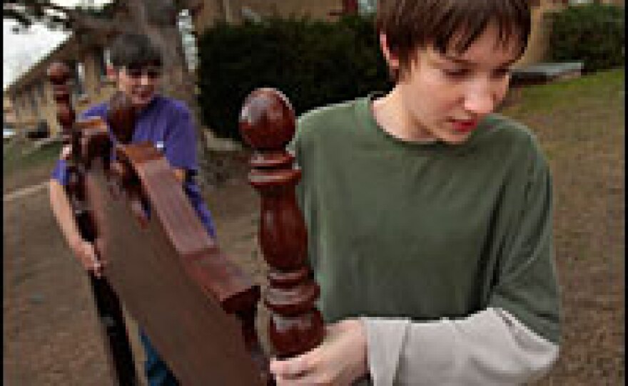 Damien DeNeir, 14, helps his grandmother Kim DeNeir move out of their Arvada, Colo., apartment, which was condemned for sewer and rodent problems. The owners of the complex blamed the subprime mortgage meltdown for the reduction in maintenance. The bursting of the housing bubble is the root of the current financial crisis.