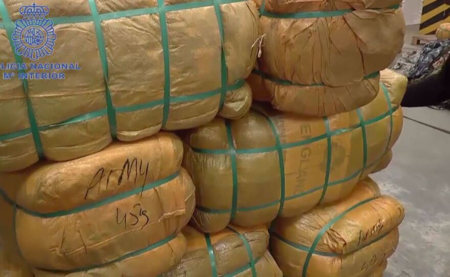 Police found bales of uniforms and accessories in containers that had been labeled as holding secondhand clothes.