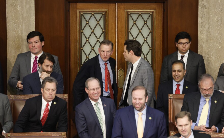 Rep.-elect Matt Gaetz (R-FL) (R) talks to Rep.-elect Paul Gosar (R-AZ) in the House Chamber during the fourth day of elections for Speaker of the House.