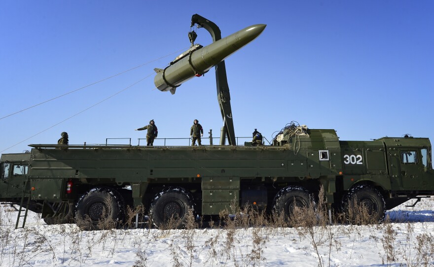 Russian troops load a missile onto an Iskander M launcher during a 2016 exercise. Russia is now deploying the missiles to Kaliningrad, a Baltic territory it controls.