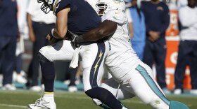 San Diego Chargers quarterback Philip Rivers (17) is sacked by Miami Dolphins defensive tackle Earl Mitchell (90) during the second half of a game, Nov. 2, 2014, in Miami Gardens, Fla. 