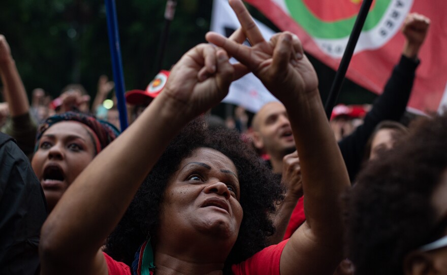 A woman asks for imprisonment of Jair Bolsonaro, Brazil's former president, during a protest in defense of democracy at the Paulista Avenue, in São Paulo, on Monday.