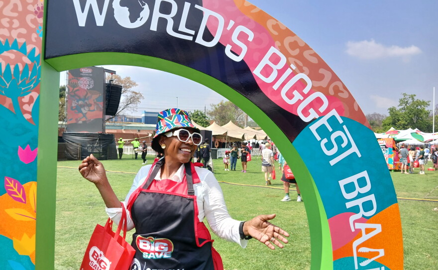 A woman poses at Loftus Versfeld Stadium in Pretoria where thousands of South Africans gathered on 24 September, 2026, to try and break the Guinness World Record for the biggest ever braai, or barbecue.