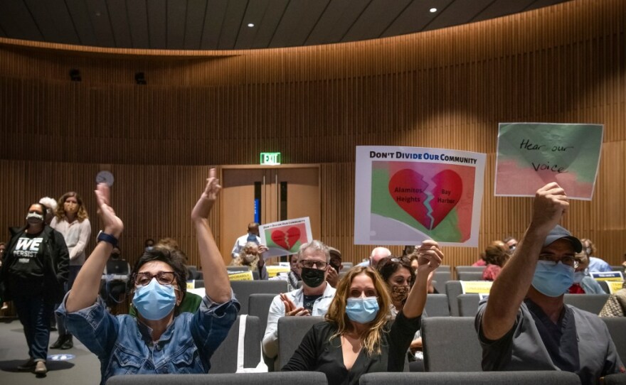 Long Beach residents from different districts urged a new independent commission to put them in the same district, during a meeting at City Hall on Oct. 20, 2021. Photo by Pablo Unzueta for CalMatters