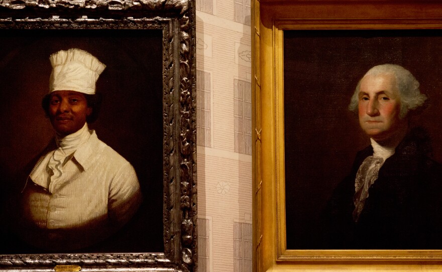 Gilbert Stuart's famous portrait of George Washington is displayed next to another portrait by Stuart that is believed to be Hercules, George Washington's cook. Hercules was with Washington during his presidency.